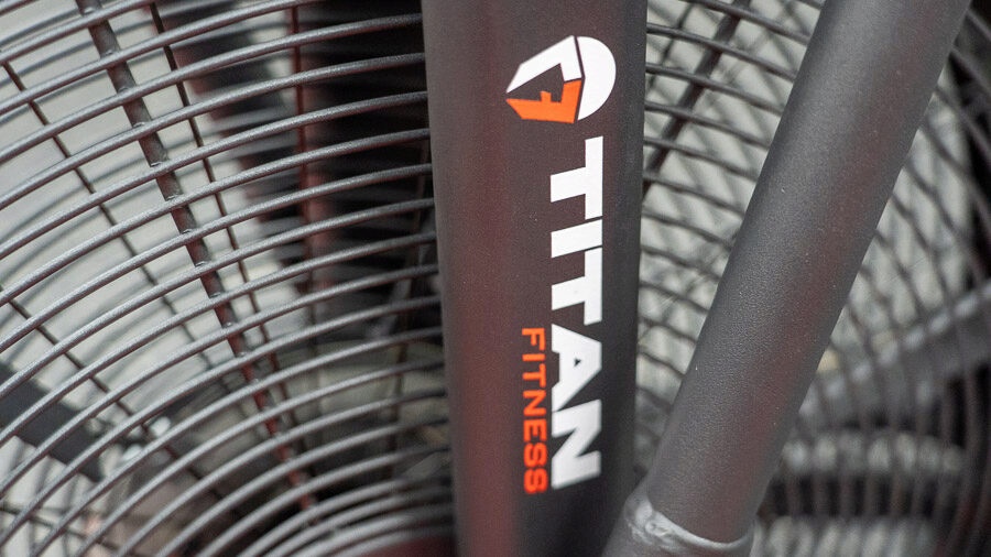 The Titan Fitness branding is shown between the spokes of the Titan Fan Bike. 