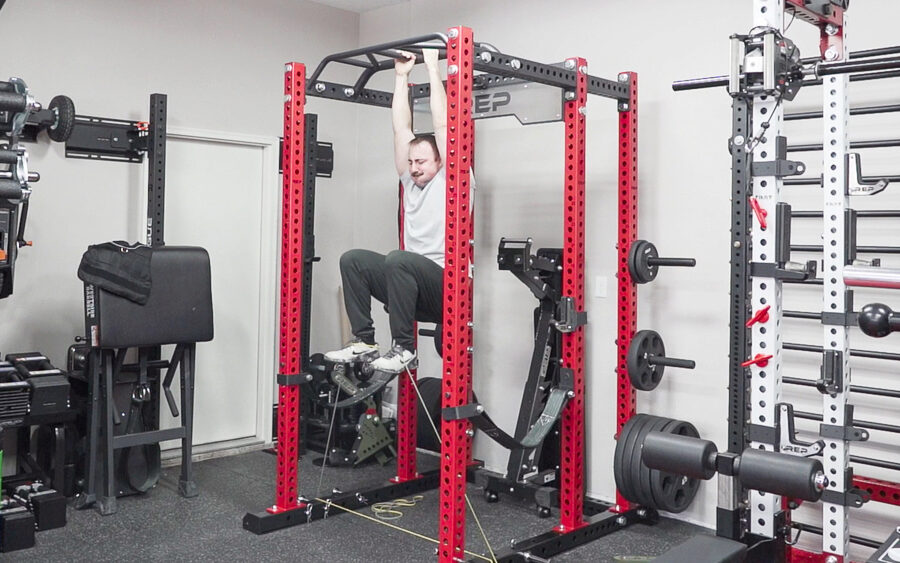 coop doing ab workouts while hanging from the REP Omni Rack