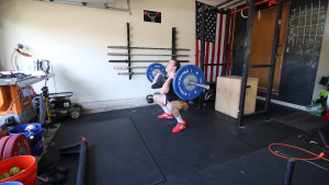 coop wearing the Adidas Leistung Weightlifting Shoes while performing a front squat