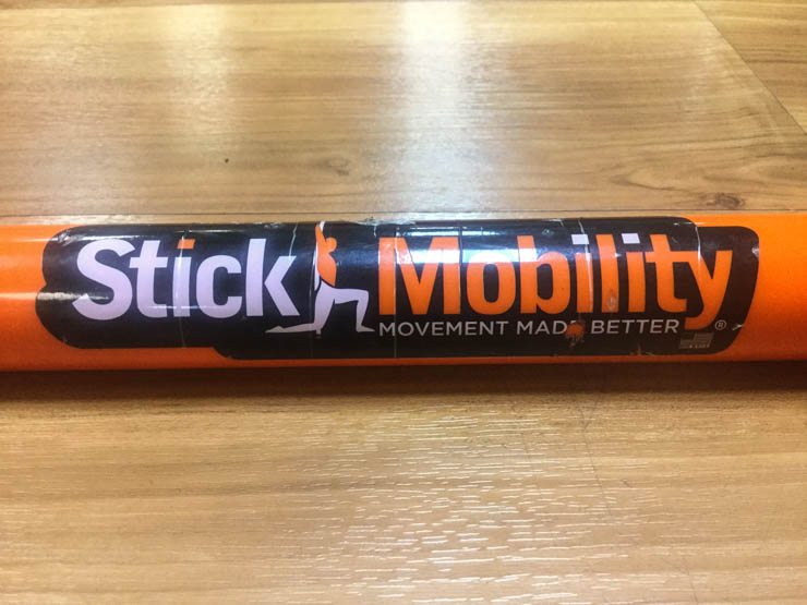 orange stick mobility on wooden floor