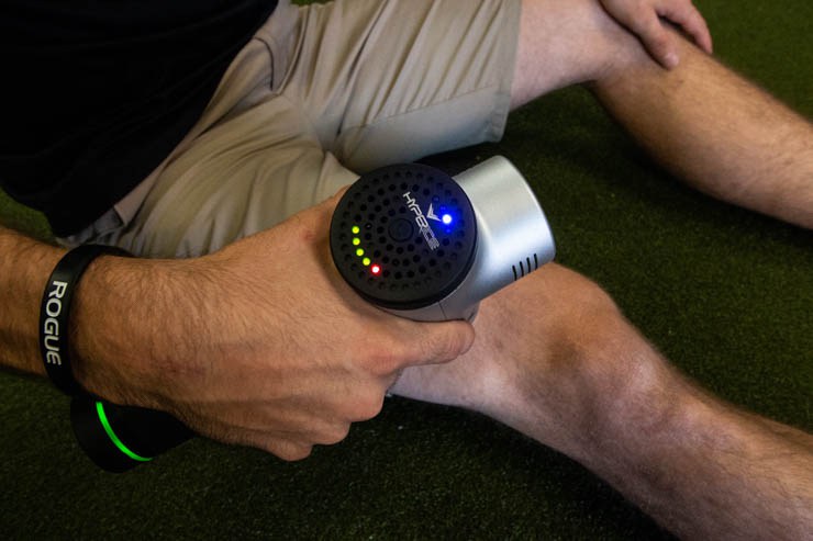 Man using the Hyperice Hypervolt on his leg