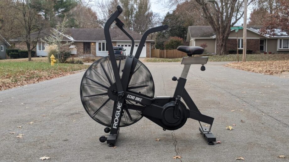 Bike sitting in a driveaway.