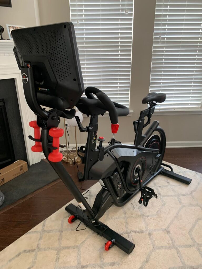 view of bowflex velocore bike from front in small home workout space