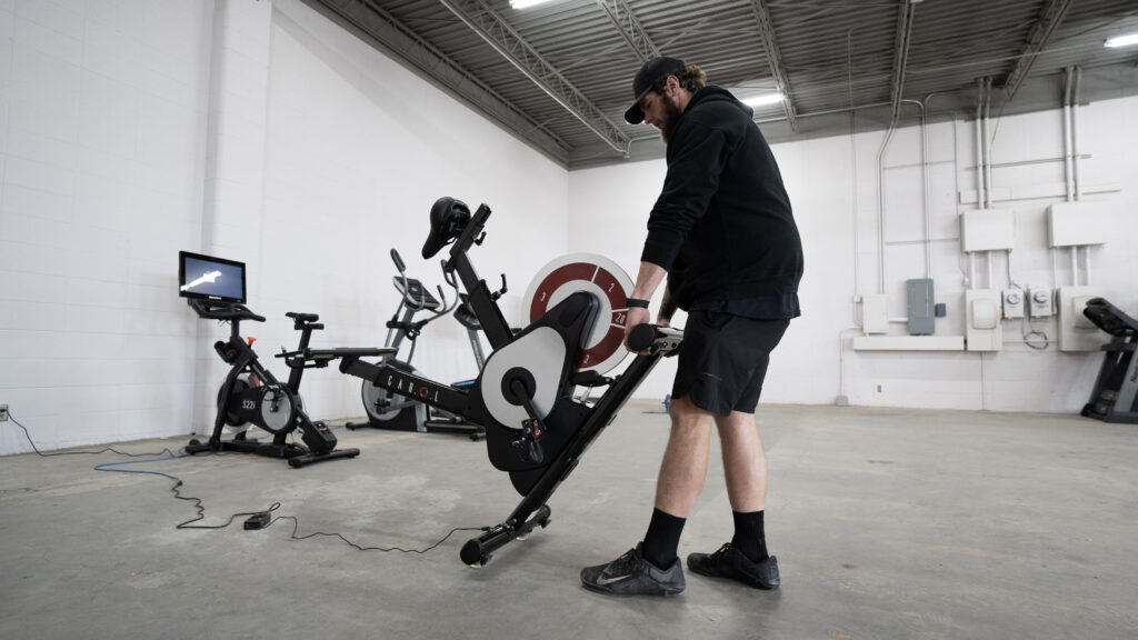 man moving an elliptical