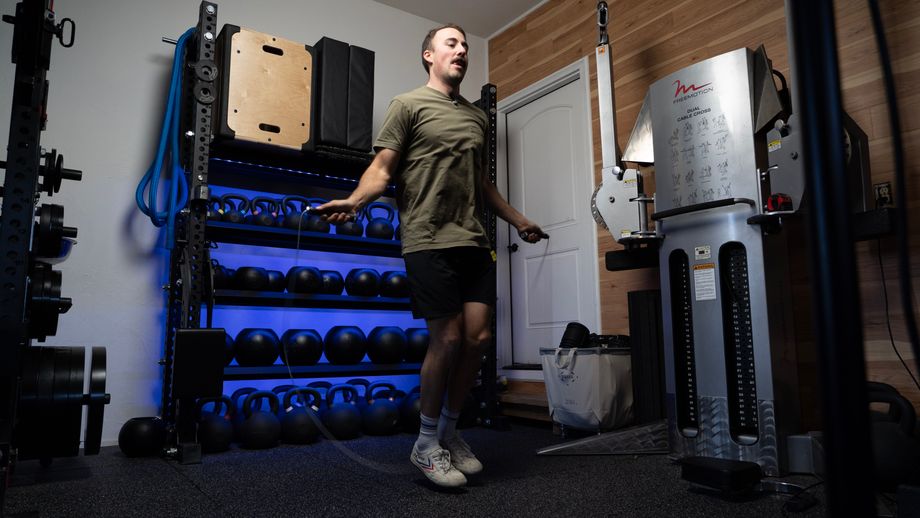 Coop jumping rope in a home gym