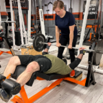 Female-spotting-decline-bench