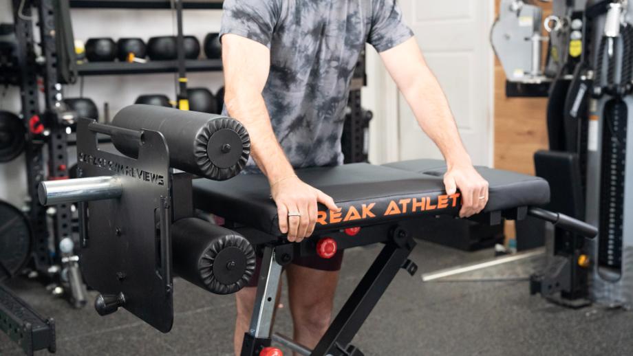 A person demonstrates the tall position on the Freak Athlete Nordic Hyper GHD weight bench