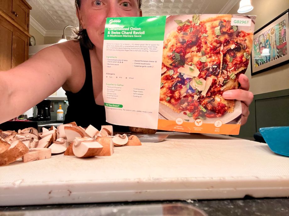 Woman showing recipe card from Gobble meal kit