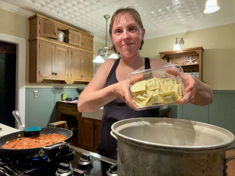 Woman showing ravioli while cooking Gobble meal kit