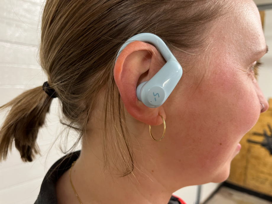 An image of HAKII earbuds in use