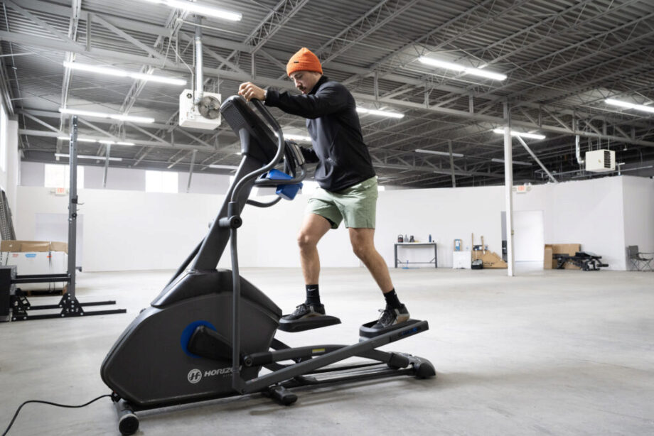 Coop using the elliptical.