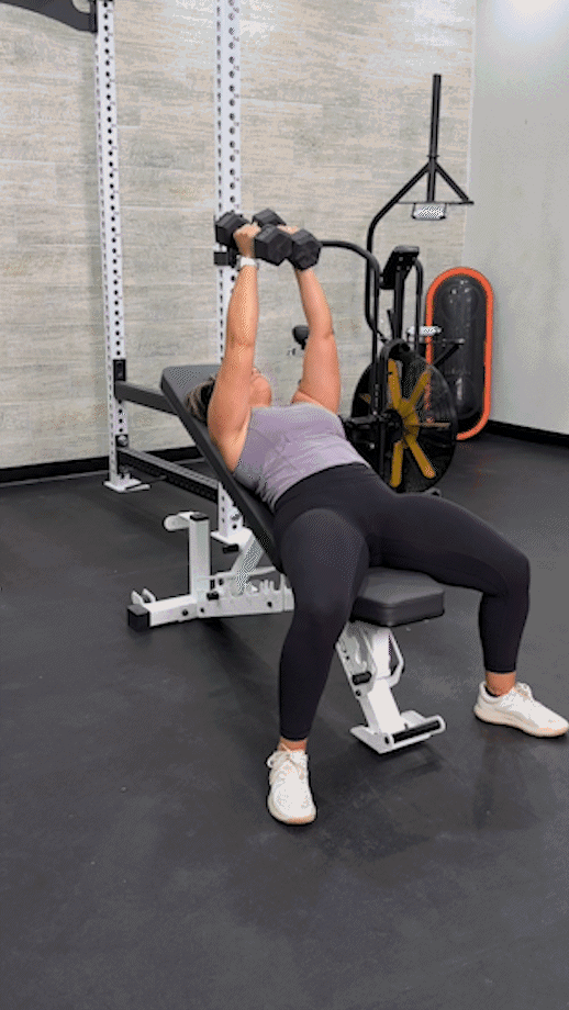 woman doing a incline dumbbell chest fly