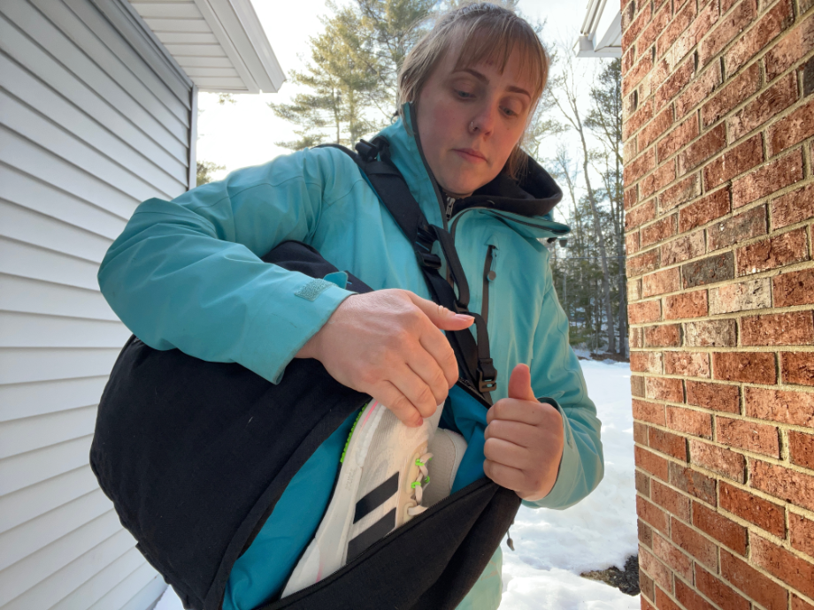 woman holding nathan backpack