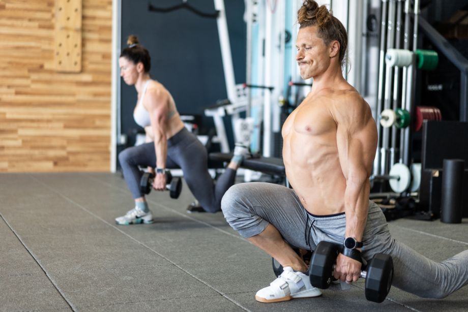 Image of man performing dumbbell ATG split squats