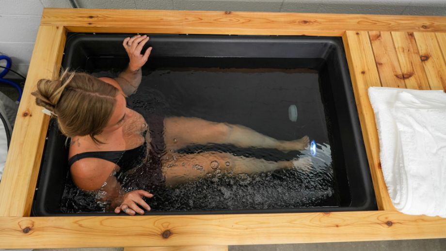 Woman submerged in Renu Therapy Cold Plunge Tub