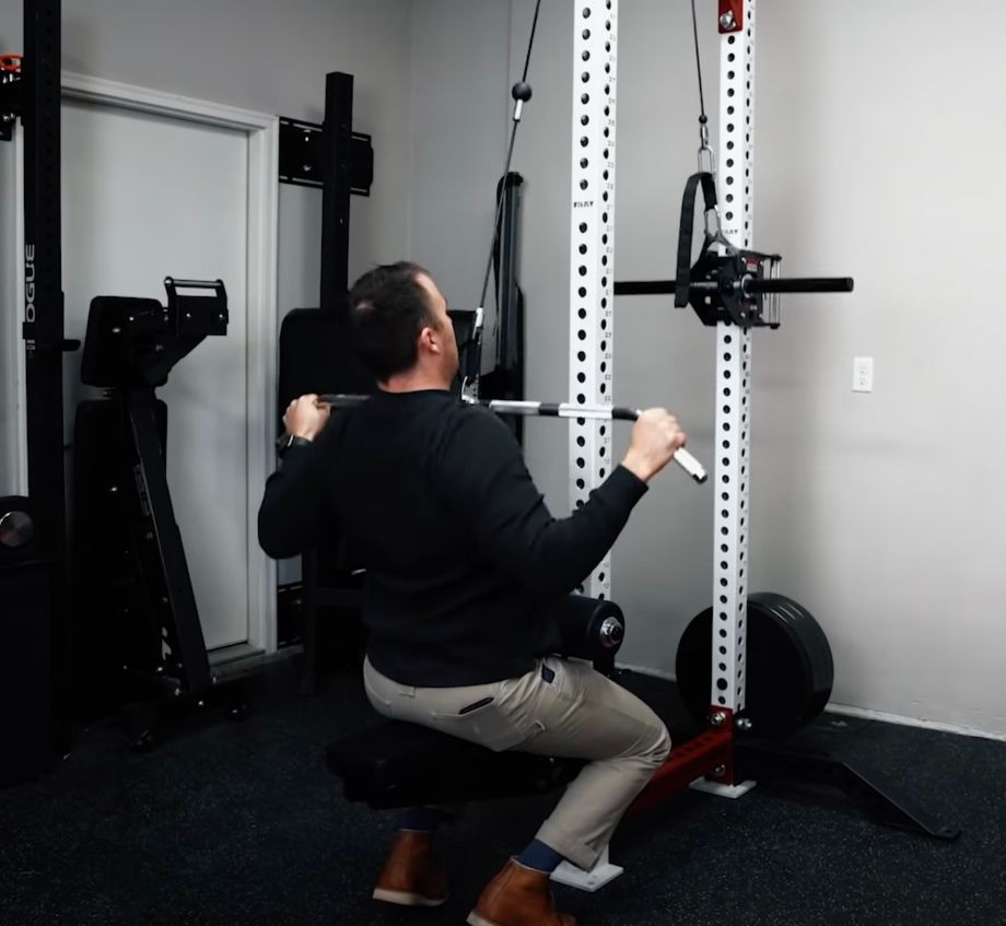 Coop using the lat pulldown seat with the slinger.