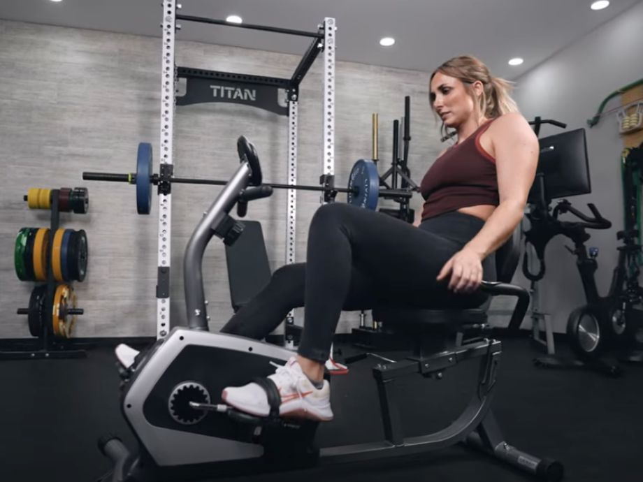 A person using the pulse grip on the Sunny Health and Fitness Essential Recumbent Bike.