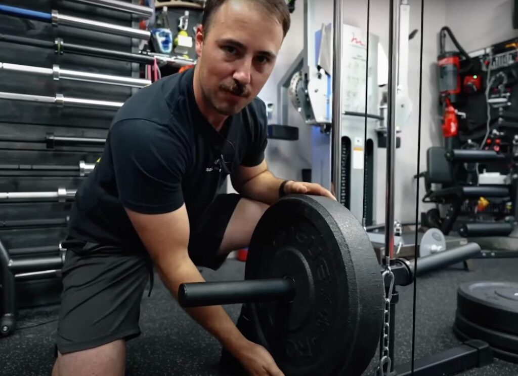 coop loading the Titan Plate Loaded Lat Pulldown