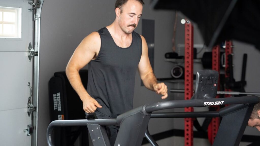 Coop running on a manual treadmill.