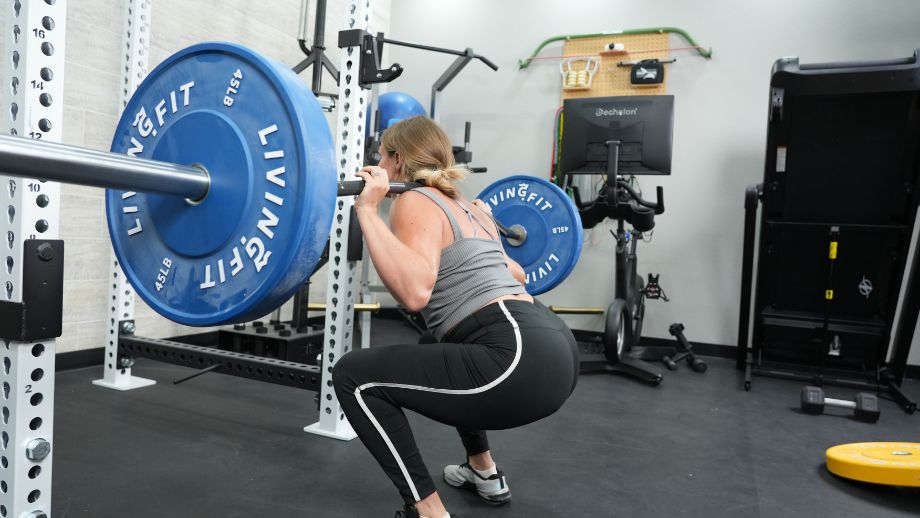 Woman squatting with Vulcan Buffalo