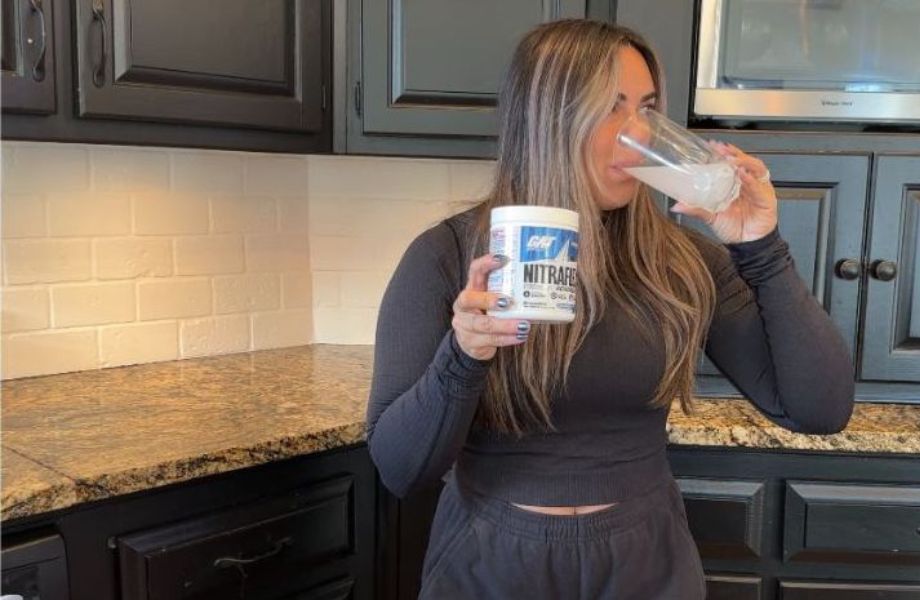 Woman drinking Nitraflex Pre-Workout