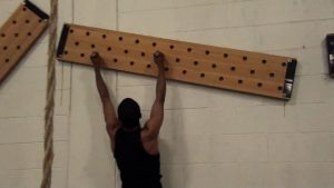 DIY Climbing Peg Board hung up on the wall