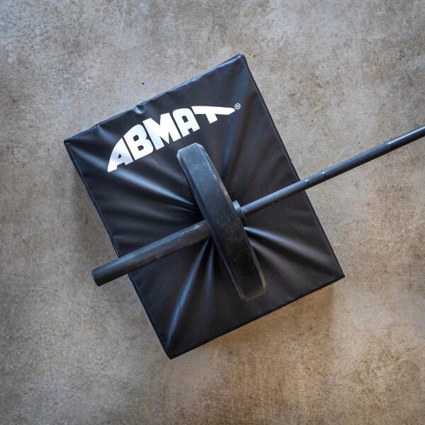 AbMat Crash Cushions being used with a barbell and weight plate.