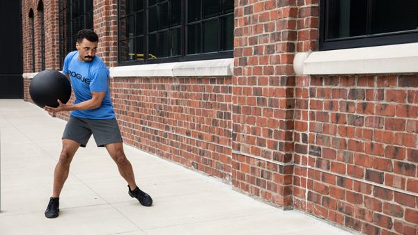 Athlete using the AbMat medicine ball for wall slams