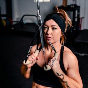 Woman using AbMat 1/4 Rings on a pulley system