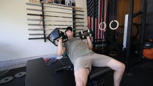 man doing dumbbell press on Rep Fitness Adjustable Flat Bench
