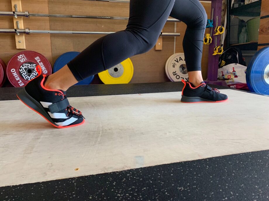 Woman doing a split squat in the Adidas Adipower 2 weightlifting shoes