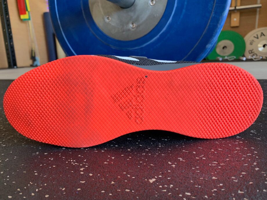 The bright orange tread on the bottom of the Adidas Adipower 2