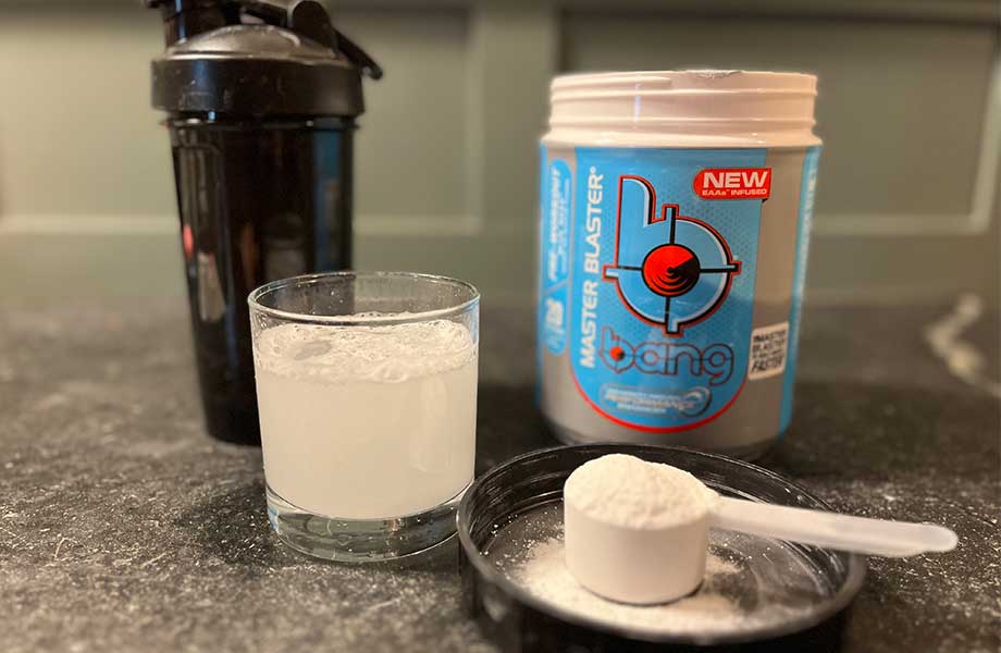 Bang Pre-Workout scoop and glass with container