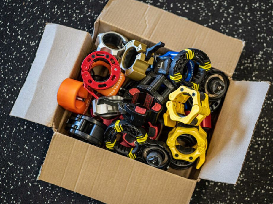 A box full of Olympic barbell collars