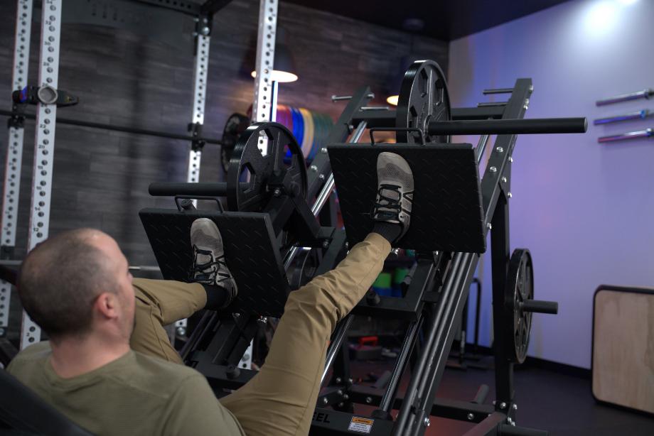 Close up of Coop doing leg presses on the Bells of Steel Iso Leg Press and Hack Squat Machine.