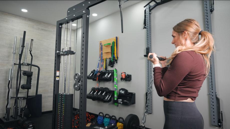 Our tester doing curls on the Bells of Steel Lat Pulldown machine.