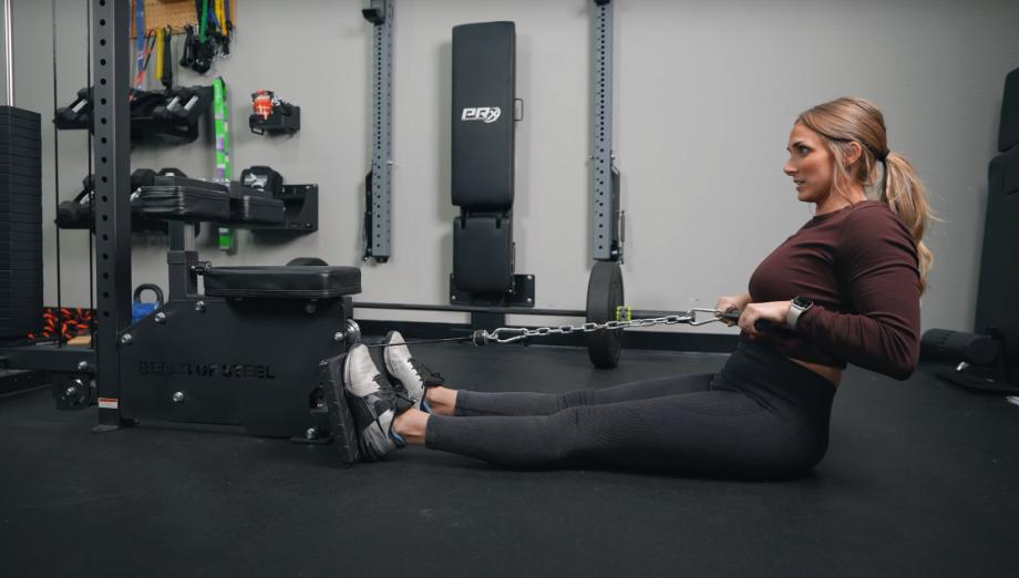 Our tester doing a low row on the Bells of Steel Lat Pulldown machine.