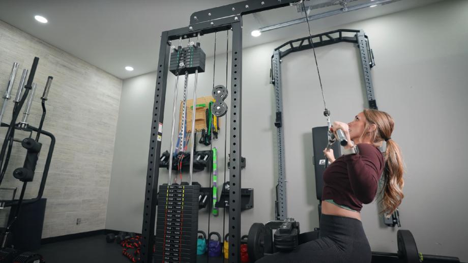 Our tester uses a wide grip on the Bells of Steel Lat Pulldown machine.