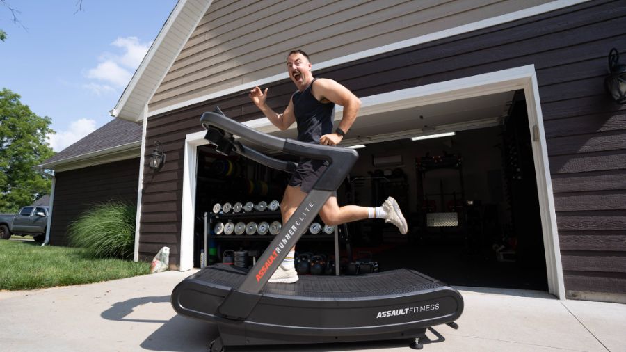 An image of a man running on the AssaultRunner Elite treadmill