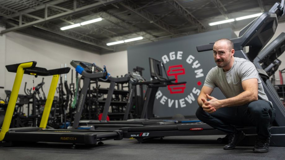 Man sitting next to the best treadmills for home