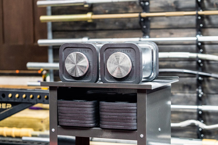 The Ironmaster quick-lock dumbbells sitting on their stand