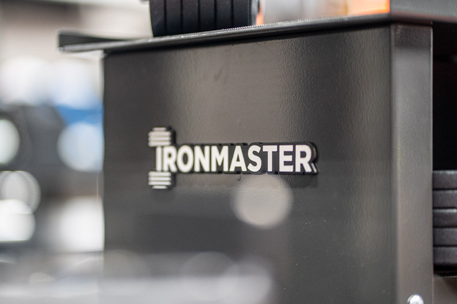 Ironmaster logo on the side of the stand for the weights