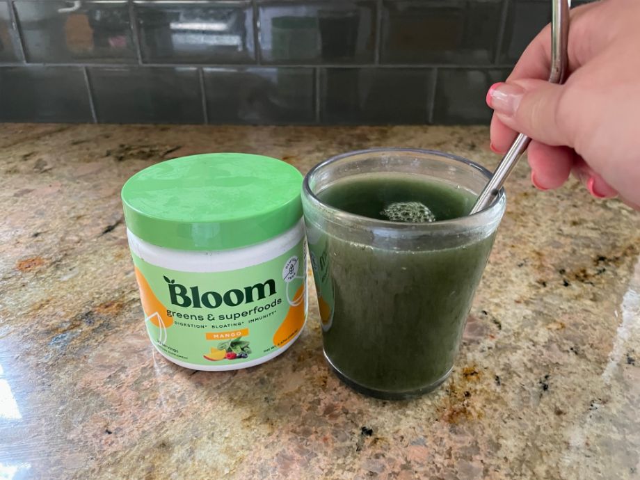 Bloom Greens Powder mixed in a glass