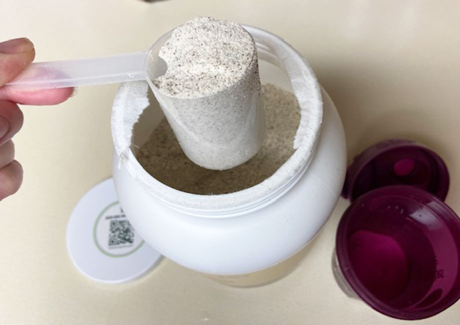 A scoop of Bloom Protein Powder