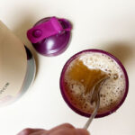 A frothy Bloom protein shake, fresh after mixing