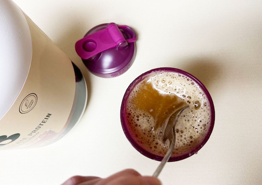 A frothy Bloom protein shake, fresh after mixing