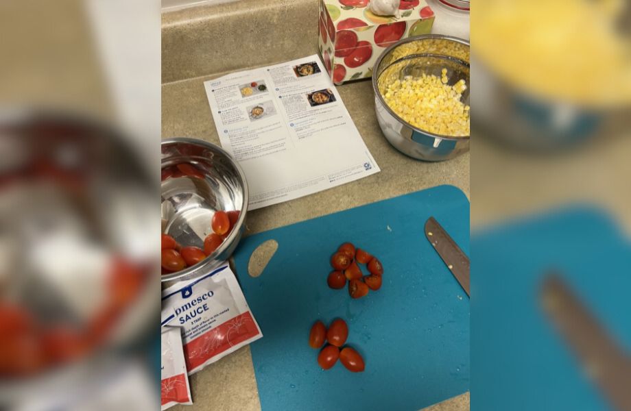 Chopped ingredients and recipe card for a Blue Apron meal
