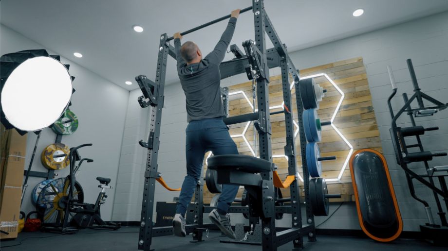 Man performing pull-ups on the Bells of Steel Hydra rack