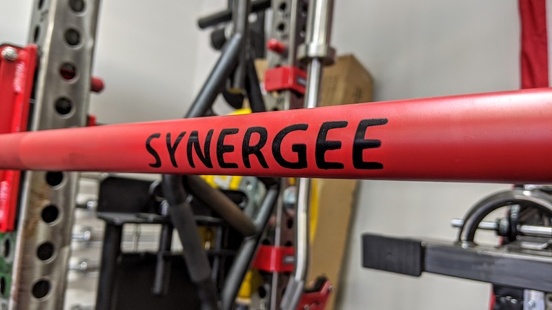 Synergee Games Cerakote Barbell logo