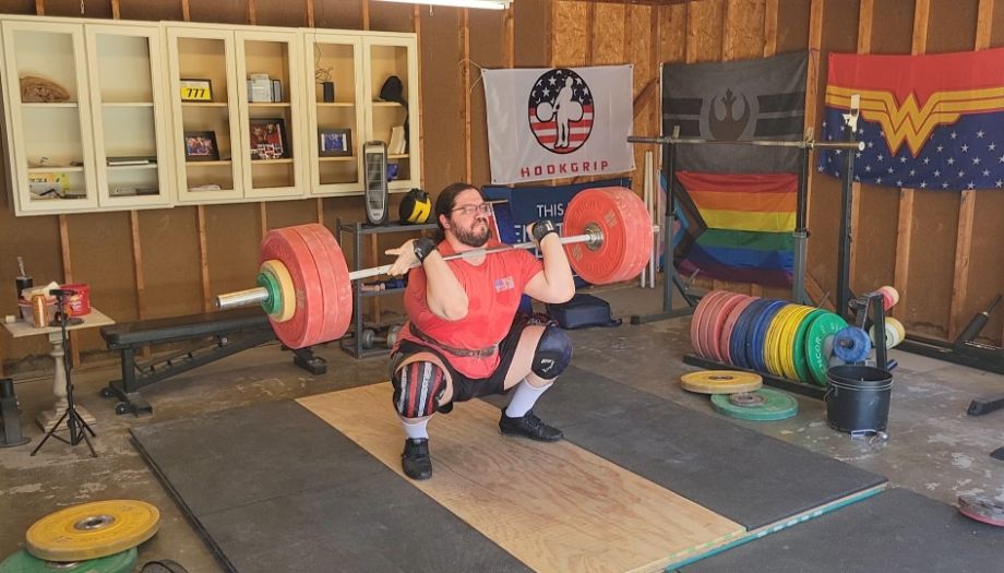 Caine performing a clean on a lifting platform